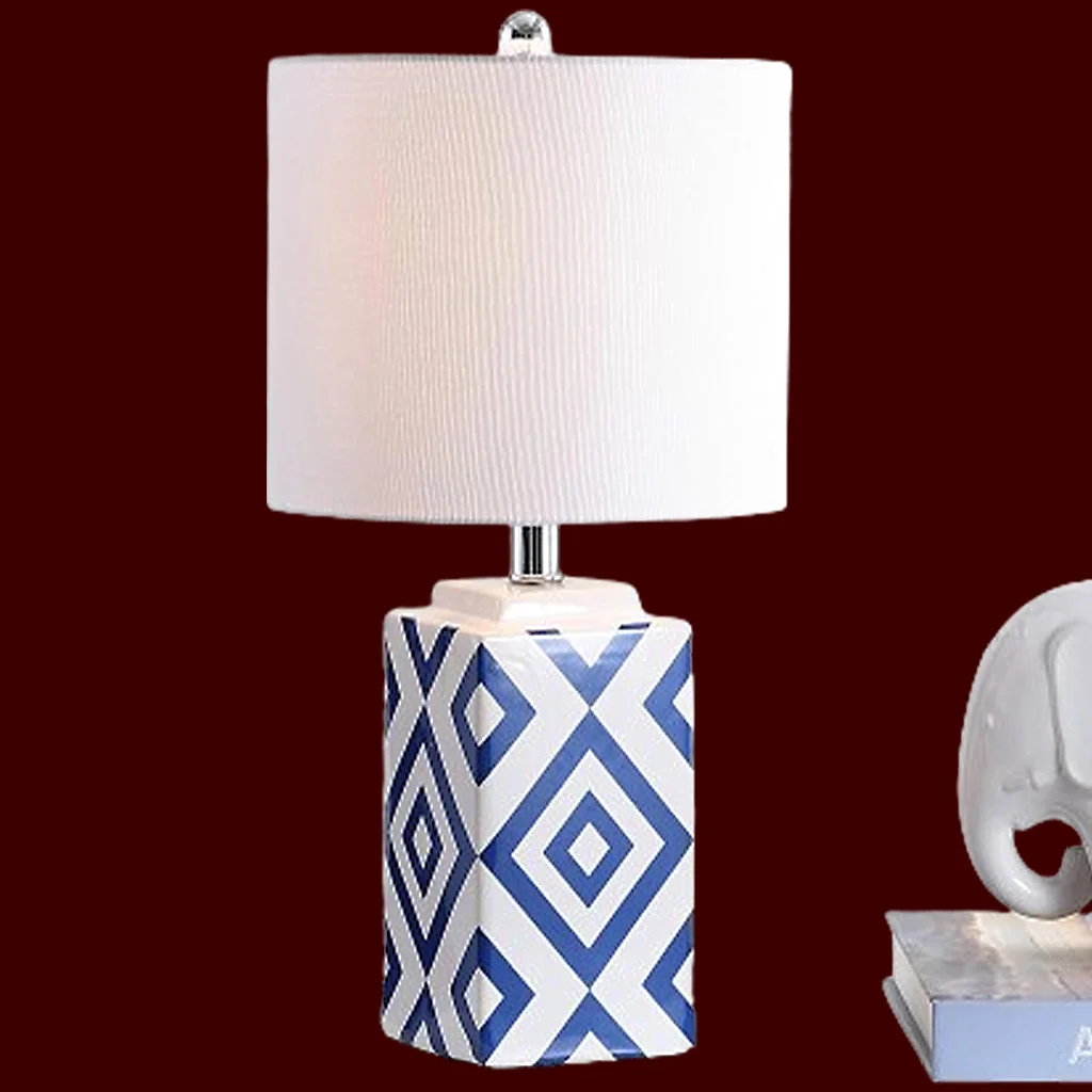 Image of a marble table lamp with blur and white base and off-white lampshade