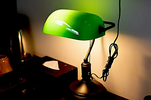 side view of a bankers lamp on a desk